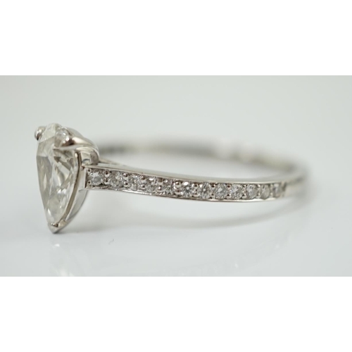 591 - A recent Boodles platinum and single stone pear cut diamond set Harmony design ring, with diamond ch... 