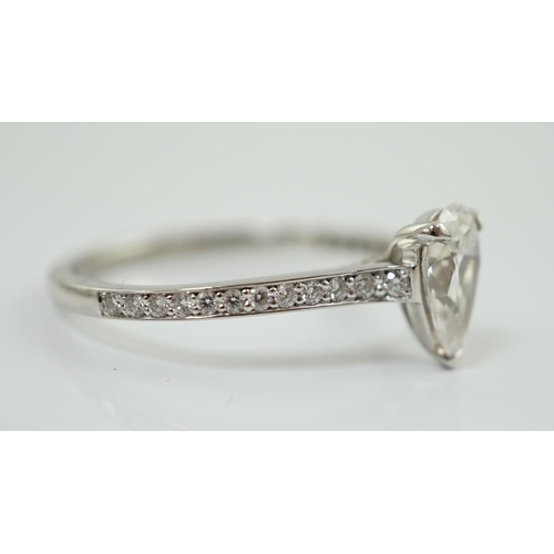 591 - A recent Boodles platinum and single stone pear cut diamond set Harmony design ring, with diamond ch... 