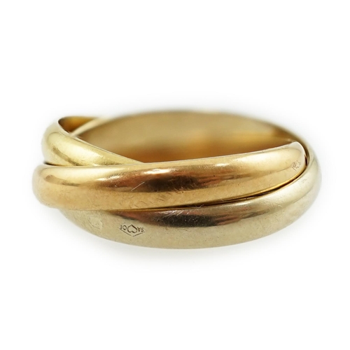 593 - A modern French Cartier three colour 18k gold 'Russian' wedding ring, signed, size E/41, 4.2 grams.... 