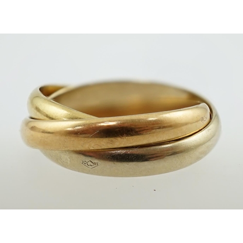 593 - A modern French Cartier three colour 18k gold 'Russian' wedding ring, signed, size E/41, 4.2 grams.... 