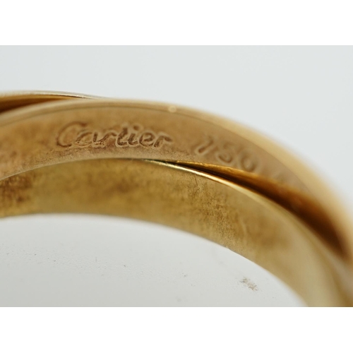 593 - A modern French Cartier three colour 18k gold 'Russian' wedding ring, signed, size E/41, 4.2 grams.... 