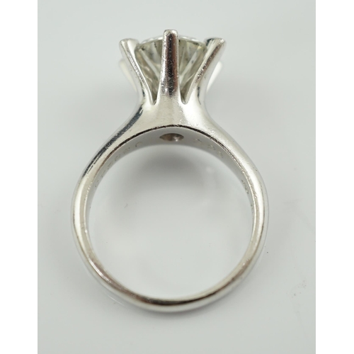 595 - A modern platinum and solitaire diamond set ring, the round brilliant cut stone weighing approximate... 