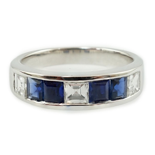 597 - A modern 14k white gold, three stone diamond and four stone sapphire half hoop ring, set with square... 