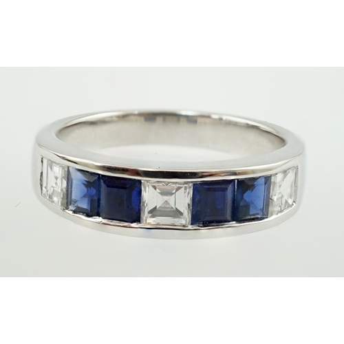 597 - A modern 14k white gold, three stone diamond and four stone sapphire half hoop ring, set with square... 