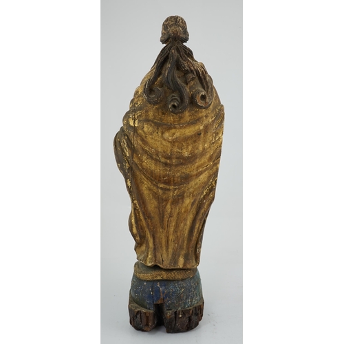 6 - An 18th century Continental carved wood figure of a female saint, with gilt and painted decoration, ... 