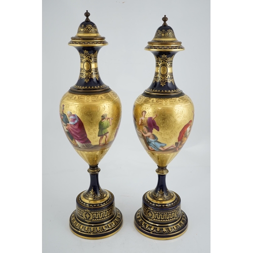 60 - A pair of tall Vienna style porcelain vases and covers, early 20th century, each painted by B.Herb, ... 