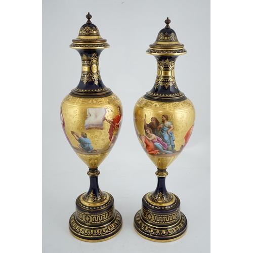 60 - A pair of tall Vienna style porcelain vases and covers, early 20th century, each painted by B.Herb, ... 