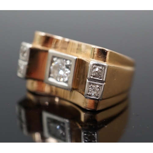 601 - A 1940's 18ct gold and four stone diamond set 'tank' dress ring, the central round brilliant cut sto... 