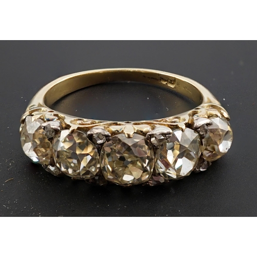 602 - A Victorian 18ct and graduated five stone old round cut diamond set half hoop ring, with diamond chi... 