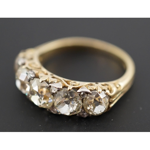 602 - A Victorian 18ct and graduated five stone old round cut diamond set half hoop ring, with diamond chi... 