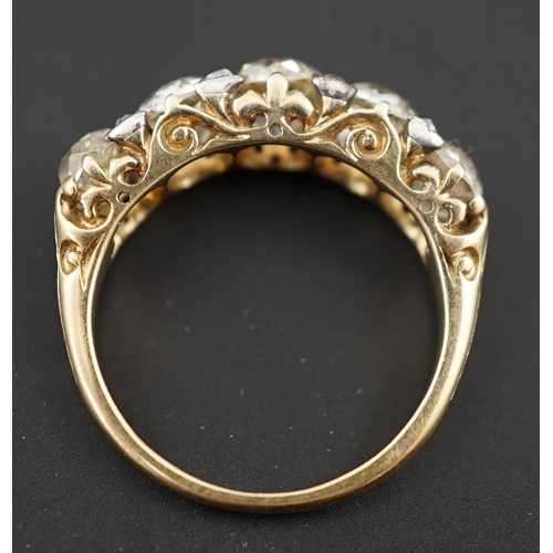 602 - A Victorian 18ct and graduated five stone old round cut diamond set half hoop ring, with diamond chi... 