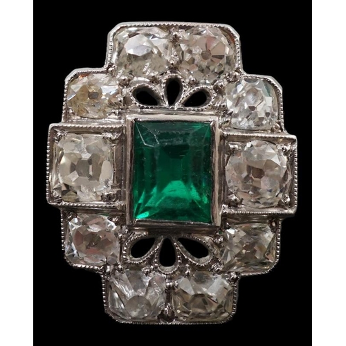 604 - An early to mid 20th century white gold?, emerald and diamond cluster set stepped oval dress ring, w... 