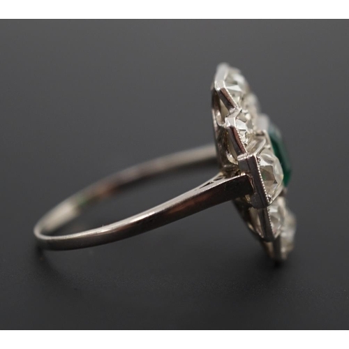 604 - An early to mid 20th century white gold?, emerald and diamond cluster set stepped oval dress ring, w... 