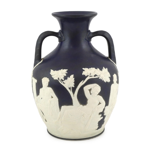 61 - A Wedgwood dark blue glazed and white sprigged replica of the  Portland vase, late 19th century, imp... 