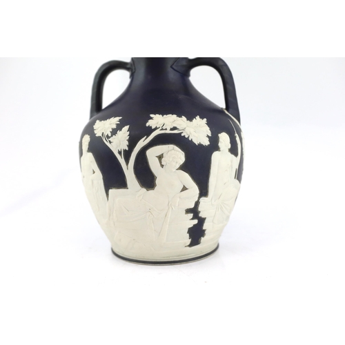 61 - A Wedgwood dark blue glazed and white sprigged replica of the  Portland vase, late 19th century, imp... 