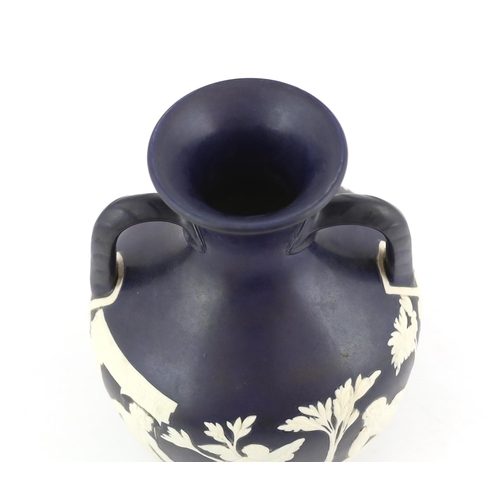 61 - A Wedgwood dark blue glazed and white sprigged replica of the  Portland vase, late 19th century, imp... 