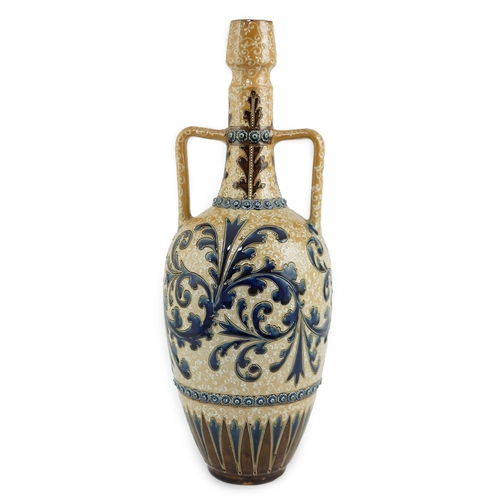 63 - George Tinworth for Doulton Lambeth, a large stoneware vase with scrolling blue foliate decoration, ... 