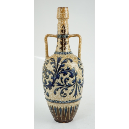 63 - George Tinworth for Doulton Lambeth, a large stoneware vase with scrolling blue foliate decoration, ... 