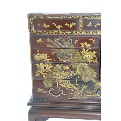 67 - A Japanese Meiji period lacquered table cabinet, Meiji period, decorated with cockerels, peacocks, f... 