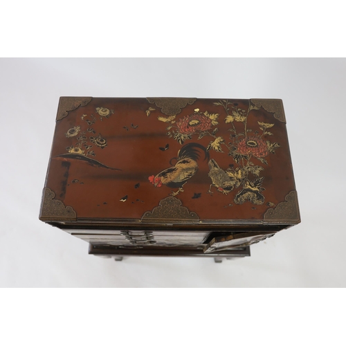 67 - A Japanese Meiji period lacquered table cabinet, Meiji period, decorated with cockerels, peacocks, f... 