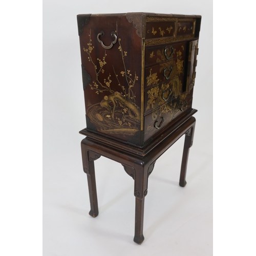 67 - A Japanese Meiji period lacquered table cabinet, Meiji period, decorated with cockerels, peacocks, f... 