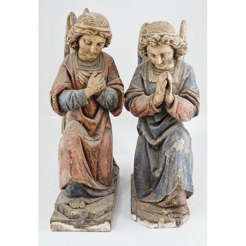 7 - A pair of late 19th century polychrome carved painted pine praying archangels, each kneeling upon a ... 