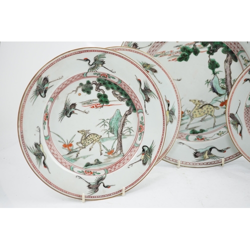 71 - A Chinese famille verte deer and crane dish and four matching plates, Kangxi period, each painted ... 