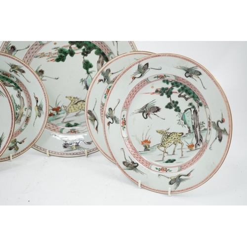 71 - A Chinese famille verte deer and crane dish and four matching plates, Kangxi period, each painted ... 