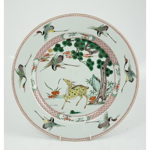 72 - A Chinese famille verte deer and crane dish, Kangxi period, painted with a deer and crane, a pine ... 