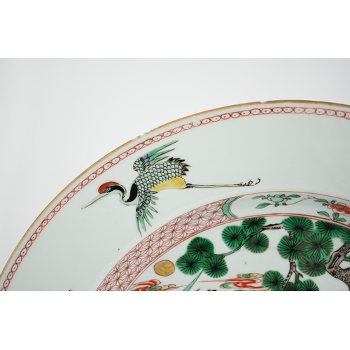 72 - A Chinese famille verte deer and crane dish, Kangxi period, painted with a deer and crane, a pine ... 