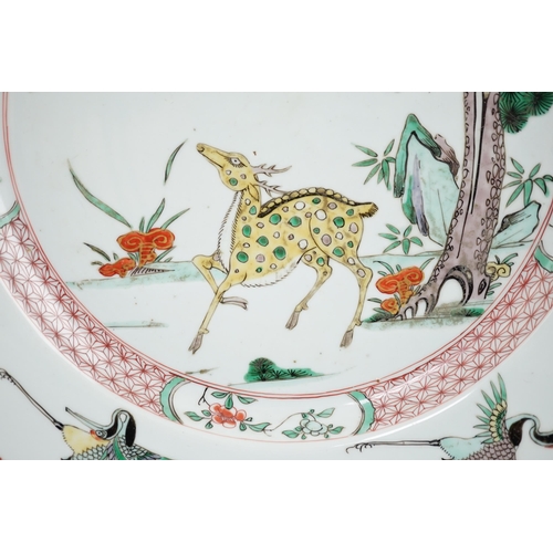 72 - A Chinese famille verte deer and crane dish, Kangxi period, painted with a deer and crane, a pine ... 