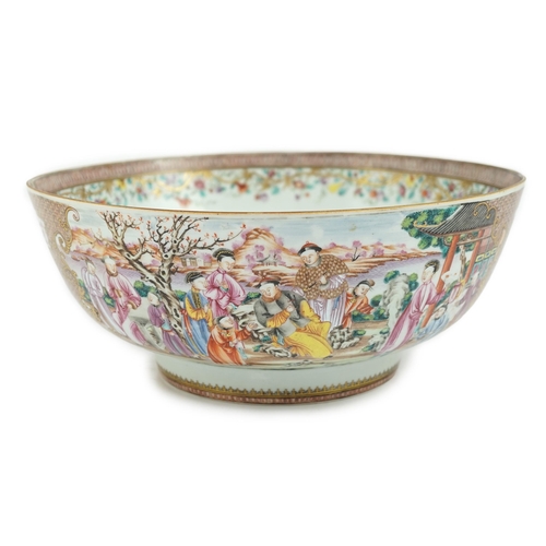 73 - A large Chinese famille rose punch bowl, Qianlong period, the interior painted with fruit and peonie... 