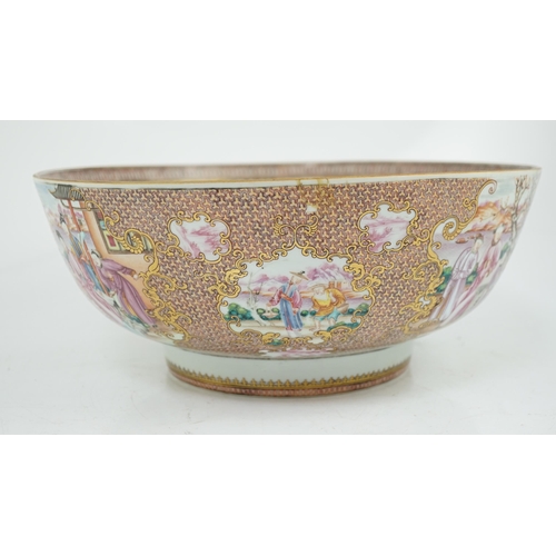 73 - A large Chinese famille rose punch bowl, Qianlong period, the interior painted with fruit and peonie... 