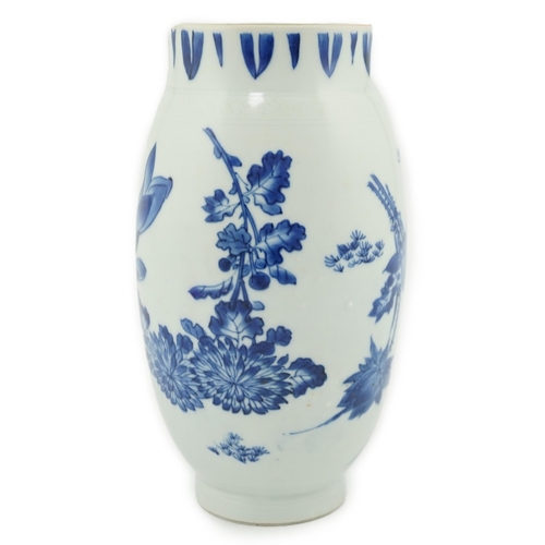 75 - A Chinese Transitional blue and white jar, c.1640, finely painted with four flower sprays, with inci... 