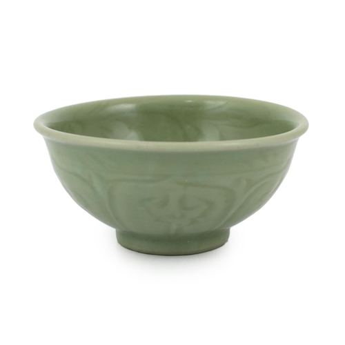 78 - A Chinese Longquan celadon bowl, Yuan Dynasty, the interior carved with lotus flowers and the exteri... 