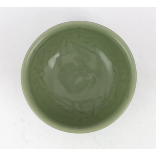 78 - A Chinese Longquan celadon bowl, Yuan Dynasty, the interior carved with lotus flowers and the exteri... 