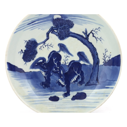 81 - A large Chinese blue and white mythical beasts saucer dish, Yongzheng period, the centre painted w... 