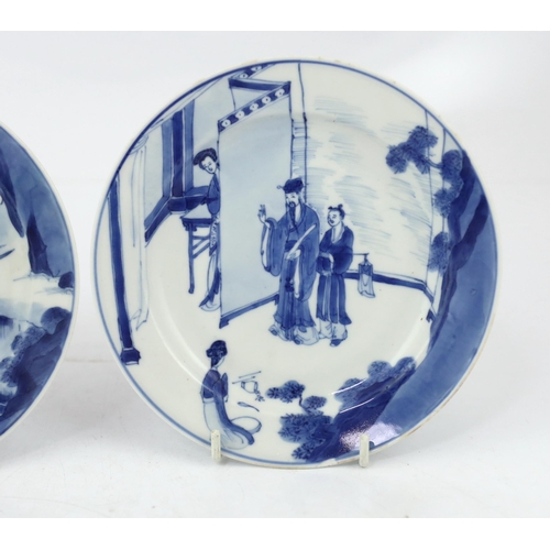 83 - A pair of Chinese blue and white small plates, Kangxi period, the first painted with figures in an i... 