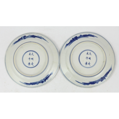 83 - A pair of Chinese blue and white small plates, Kangxi period, the first painted with figures in an i... 