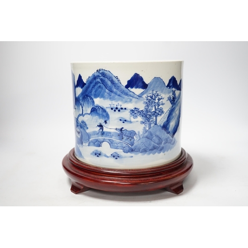 89 - A Chinese blue and white landscape cylindrical brushpot, bitong, 19th century, painted with figure... 