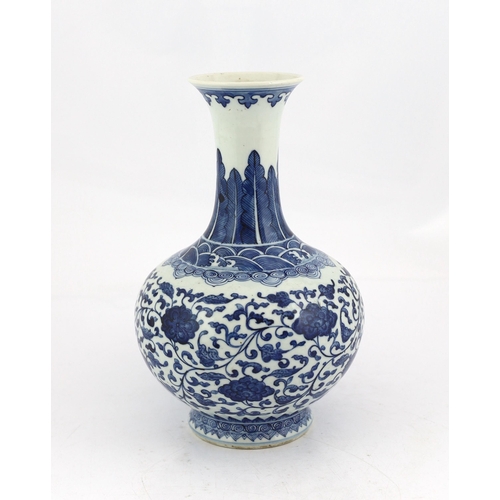 91 - A Chinese blue and white lotus vase, 20th century, painted with lotus flowers and scrolling leaves... 