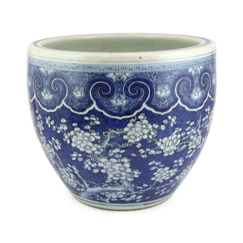 96 - -A large Chinese blue and white prunus jardiniere, 19th century, painted with prunus below a band ... 
