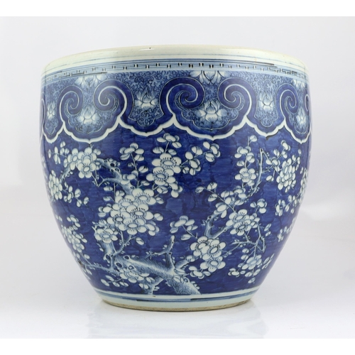 96 - -A large Chinese blue and white prunus jardiniere, 19th century, painted with prunus below a band ... 