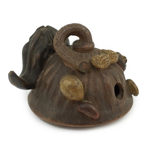 98 - A Chinese Yixing 'lotus' water dropper, late 19th/early 20th century, with movable nodules to the he... 
