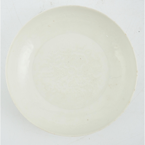 99 - A Chinese moulded white glazed saucer dish, Yongle mark, Republic period, the centre moulded with a ... 