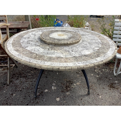 1007 - A circular mosaic stone garden table with 'Lazy Susan', diameter 150cm, height 74cm.  Condition - fa... 