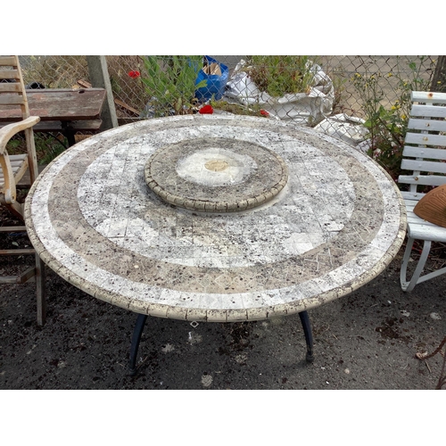 1007 - A circular mosaic stone garden table with 'Lazy Susan', diameter 150cm, height 74cm.  Condition - fa... 