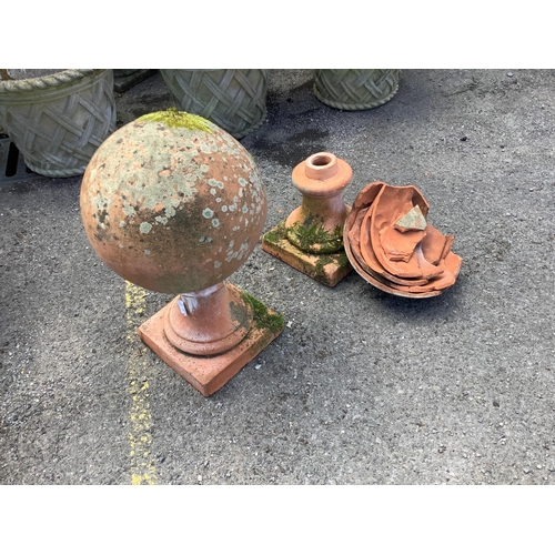1024 - A large pair of weathered terracotta sphere garden ornaments, one in need of restoration, height 58c... 