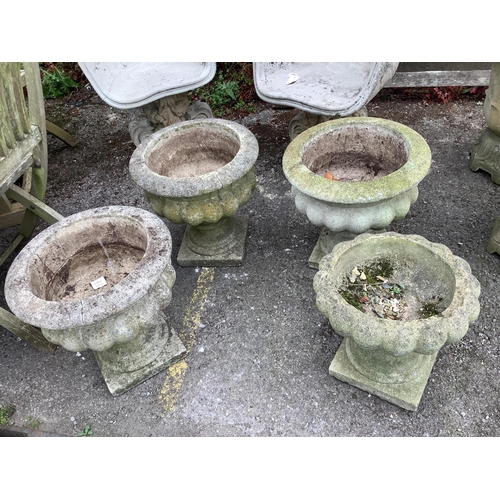 1026 - Four (three plus one) circular reconstituted stone garden planters, larger diameter 40cm, height 41c... 