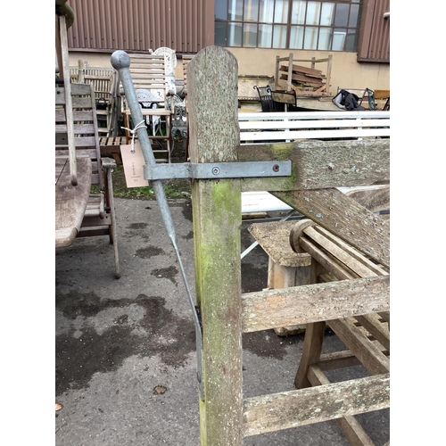 1032 - A pair of 10ft Biddenden hardwood gates with galvanised mounts. Condition - fair